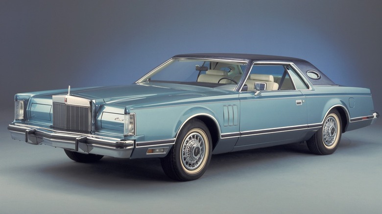 Blue 1979 Lincoln Continental Mark V seen from left front in studio