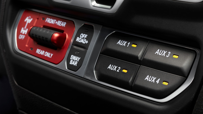 AUX switches on a Jeep Wrangler dashboard.